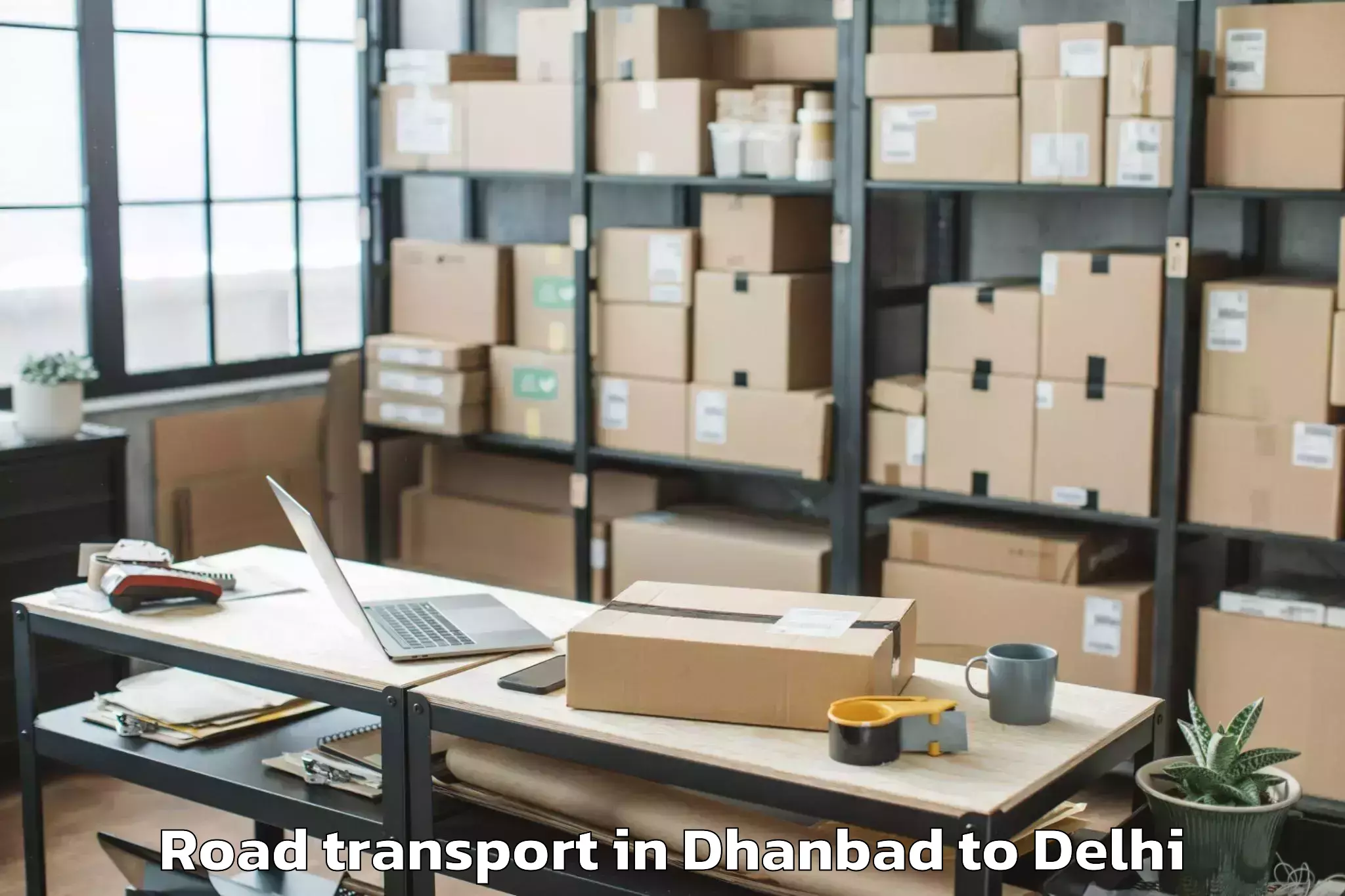 Trusted Dhanbad to Indira Gandhi International Ai Road Transport